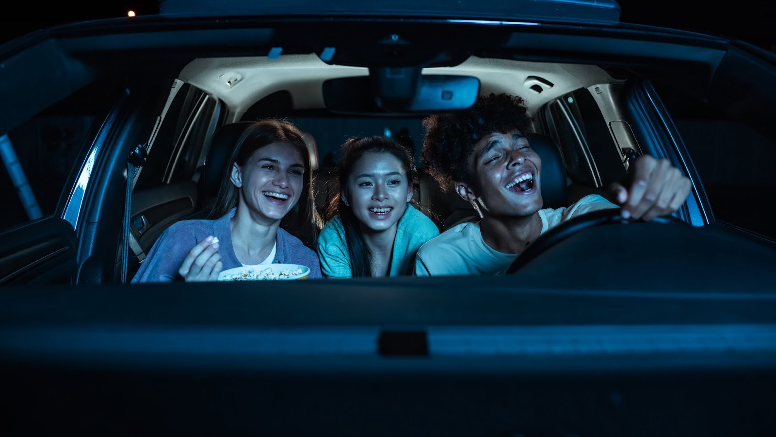 A group of friends enjoying a drive-in
